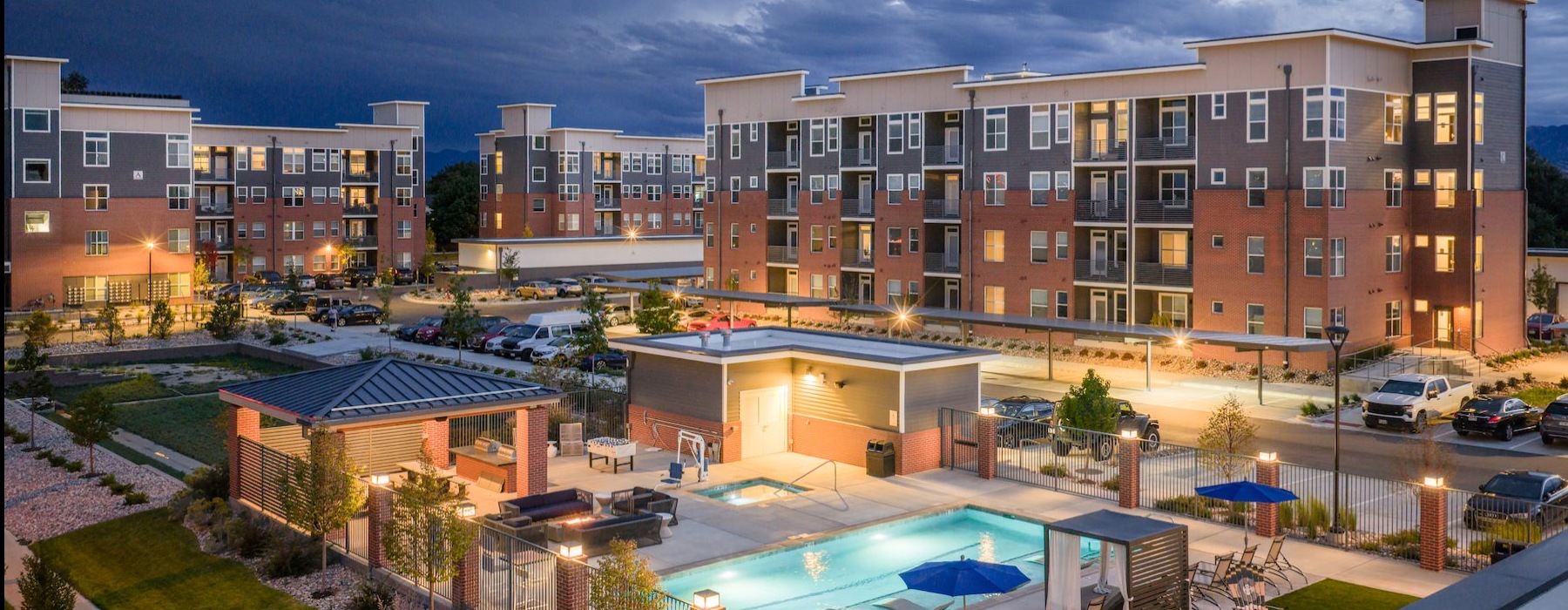 Resort-style swimming pool swimming pool lit at night
