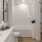 a bathroom with white counter tops