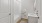 a bathroom with a white tile shower with tub