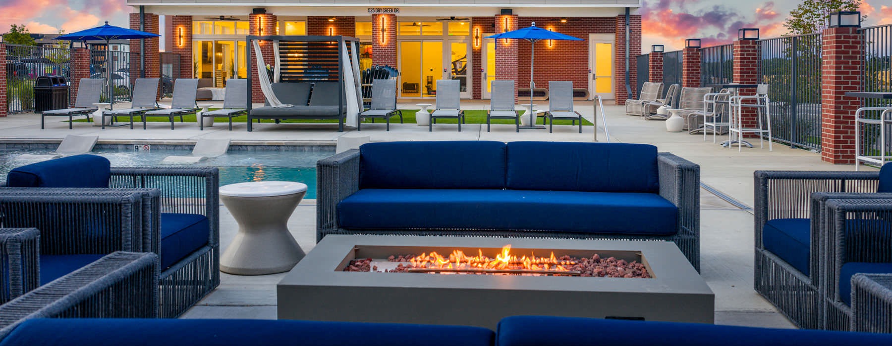 outdoor fire pit surrounded by chairs