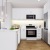 a kitchen with white cabinets