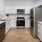 a kitchen with white counter tops