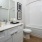 a bathroom with white counter tops