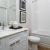 a bathroom with white counter tops