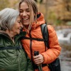 a couple of women smiling while hiking