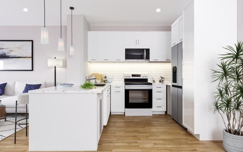 a kitchen with white cabinets